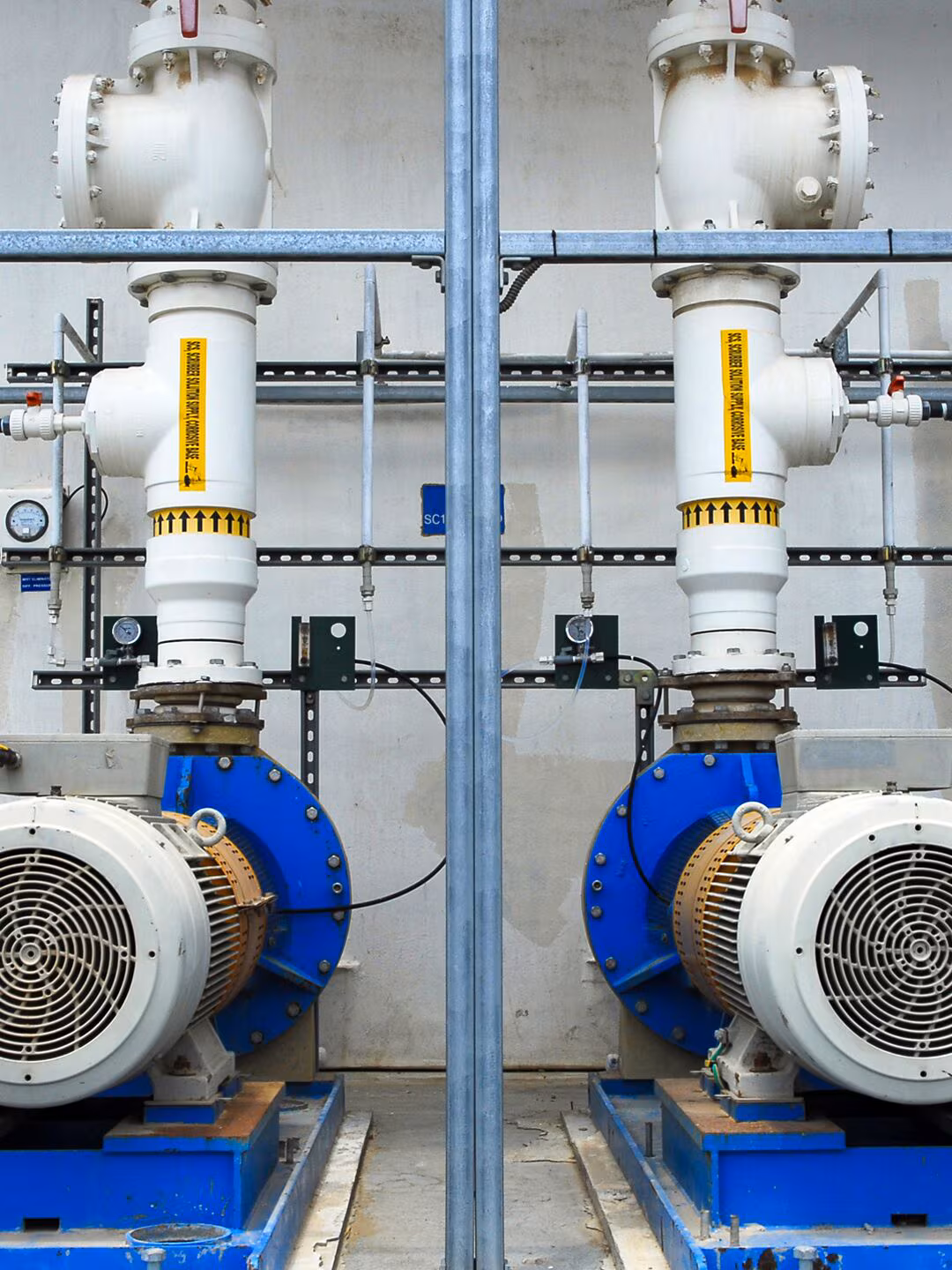 Electric motors and water pumps on an industrial workbench